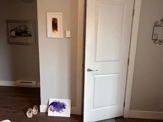Before: the bare wall by the bathroom door